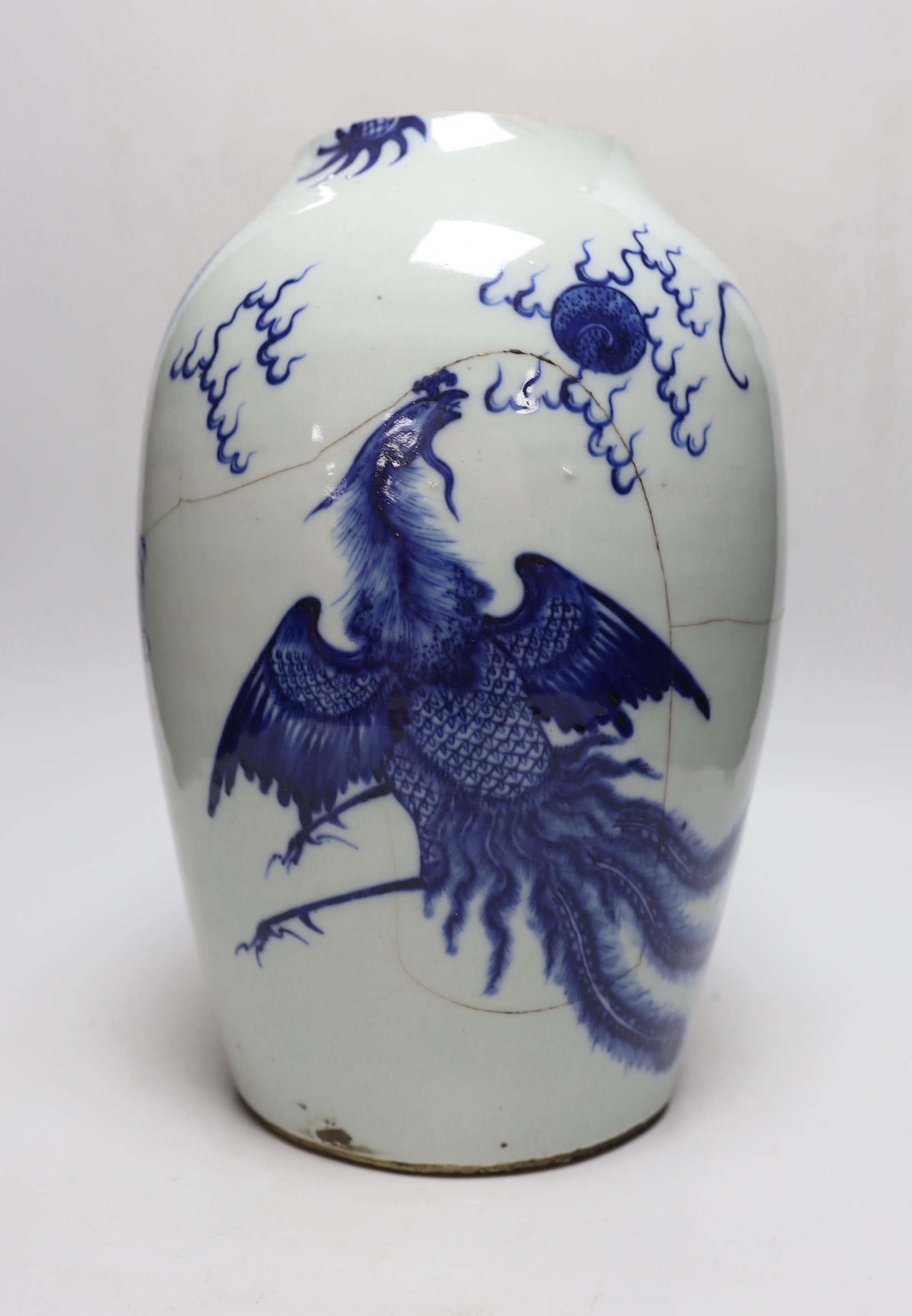 A Chinese blue and white ‘dragon’ vase, Qing dynasty, neck cut down, 33cm high